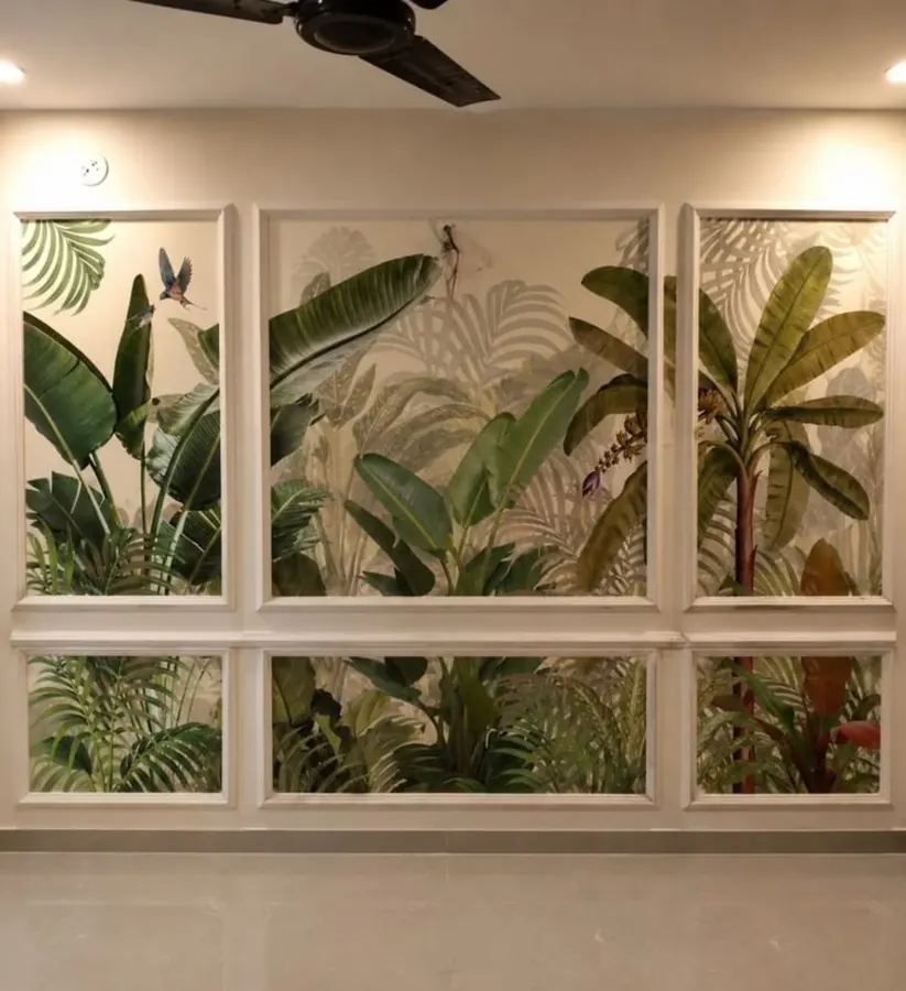 Full-wall botanical installation with decorative moulding